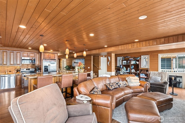 8116 Naketa Beach Walk, Mukilteo, WA 98275 - living room with wood ceiling, recessed lighting, dark wood finished floors, and wood walls