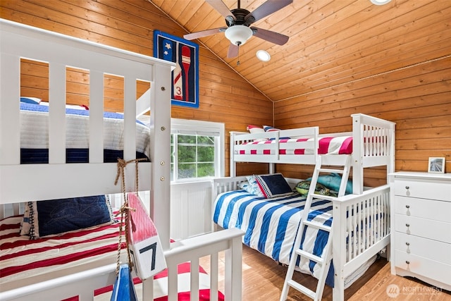 8116 Naketa Beach Walk, Mukilteo, WA 98275 - bedroom featuring vaulted ceiling, wooden walls, wood ceiling, and wood finished floors
