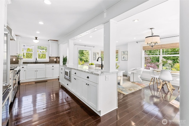 1014 Cherry Ave NE, Bainbridge Island, WA 98110 - kitchen with stainless steel appliances, healthy amount of natural light, dark wood-style flooring, white cabinetry, and recessed lighting