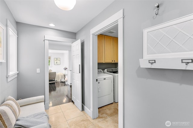 1014 Cherry Ave NE, Bainbridge Island, WA 98110 - laundry area with cabinet space, independent washer and dryer, light tile patterned floors, and recessed lighting