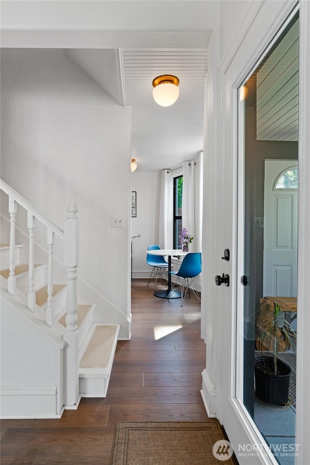 605 N Sampson St, Ellensburg, WA 98926 - hall featuring dark wood-style floors, stairs, and baseboards