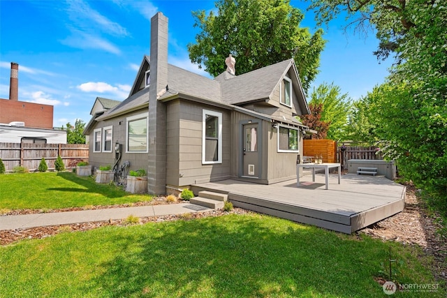 605 N Sampson St, Ellensburg, WA 98926 - rear view of house with a chimney, a wooden deck, and roof with shingles