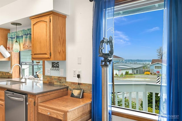 8061 Niska Rd, Blaine, WA 98230 - kitchen featuring a sink, stainless steel dishwasher, and hanging light fixtures