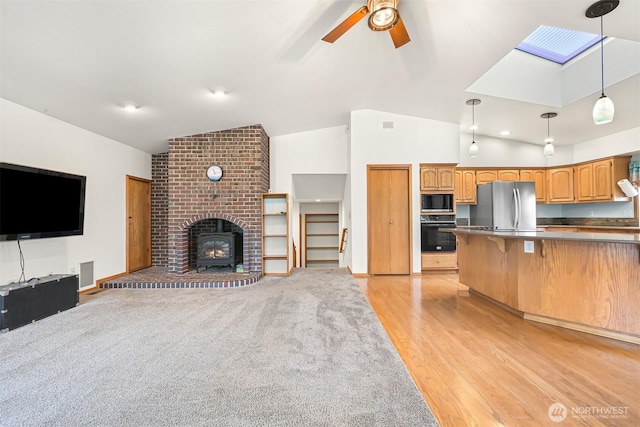 8061 Niska Rd, Blaine, WA 98230 - living area featuring lofted ceiling, a ceiling fan, and light wood finished floors