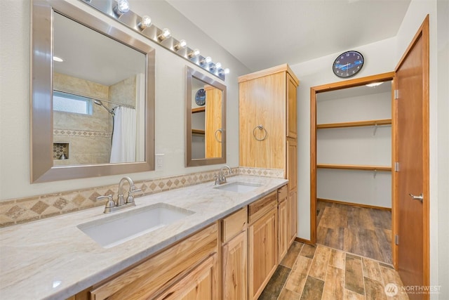 8061 Niska Rd, Blaine, WA 98230 - full bath featuring double vanity, wood finished floors, and a shower with curtain
