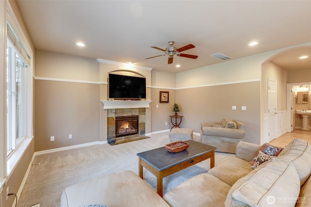 30630 122nd Ave SE, Auburn, WA 98092 - living room featuring arched walkways, ceiling fan, a tiled fireplace, recessed lighting, and baseboards