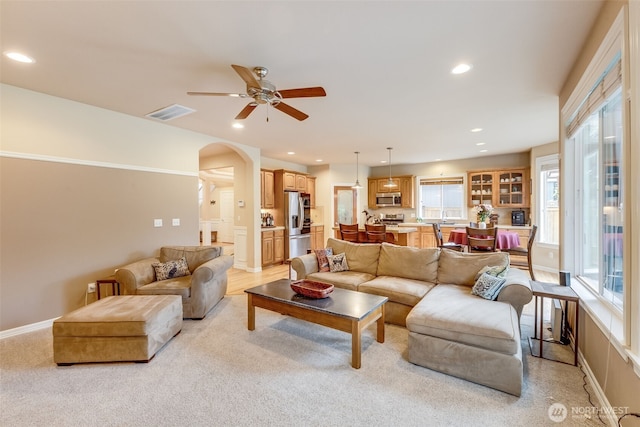 30630 122nd Ave SE, Auburn, WA 98092 - living area featuring arched walkways, ceiling fan, recessed lighting, plenty of natural light, and light colored carpet