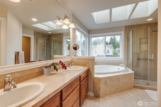 30630 122nd Ave SE, Auburn, WA 98092 - full bath featuring a skylight, a stall shower, a bath, tile patterned flooring, and double vanity