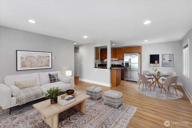 21307 48th Ave W Unit C206, Mountlake Terrace, WA 98043 - living area featuring light wood-style floors, baseboards, and recessed lighting