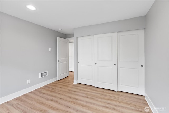 21307 48th Ave W Unit C206, Mountlake Terrace, WA 98043 - unfurnished bedroom with baseboards, light wood-style flooring, recessed lighting, and a closet
