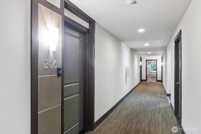 21307 48th Ave W Unit C206, Mountlake Terrace, WA 98043 - hallway with dark colored carpet, recessed lighting, and baseboards