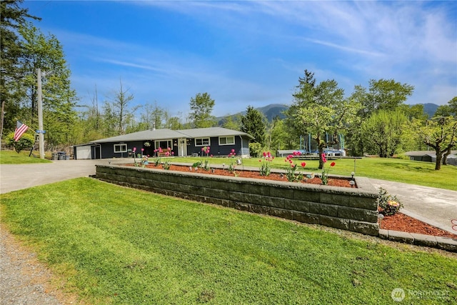 16015 Lange Rd, Mount Vernon, WA 98273 - view of property's community featuring a yard, a mountain view, and driveway