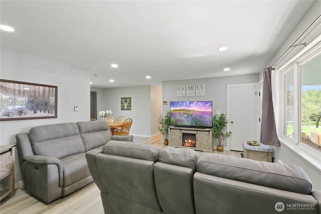 16015 Lange Rd, Mount Vernon, WA 98273 - living room featuring recessed lighting, light wood-style floors, a tile fireplace, and baseboards
