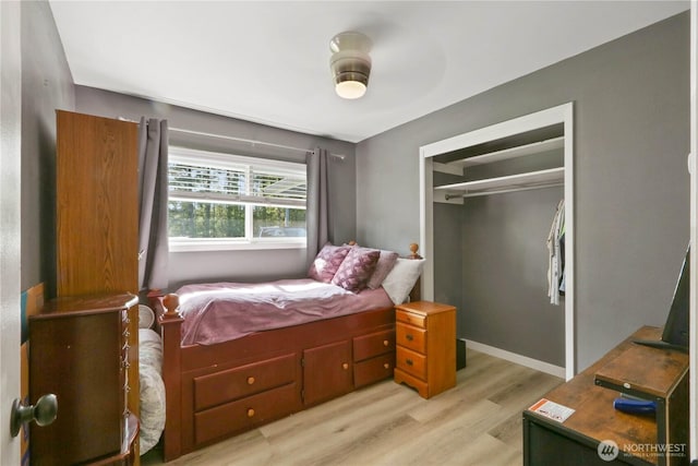 16015 Lange Rd, Mount Vernon, WA 98273 - bedroom with light wood-style flooring, a closet, and baseboards