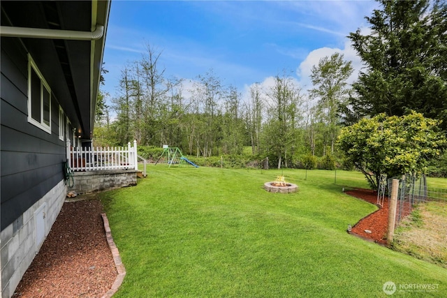 16015 Lange Rd, Mount Vernon, WA 98273 - view of green lawn with a fire pit and a playground