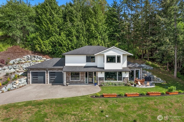 1048 Malvern Hills Dr, Camano Island, WA 98282 - view of front of house with a garage, driveway, stone siding, and a front yard