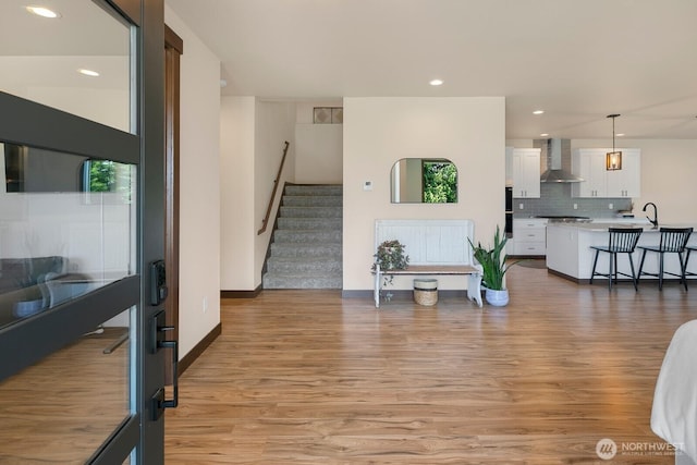 1048 Malvern Hills Dr, Camano Island, WA 98282 - living room featuring light wood-type flooring, stairs, recessed lighting, and baseboards