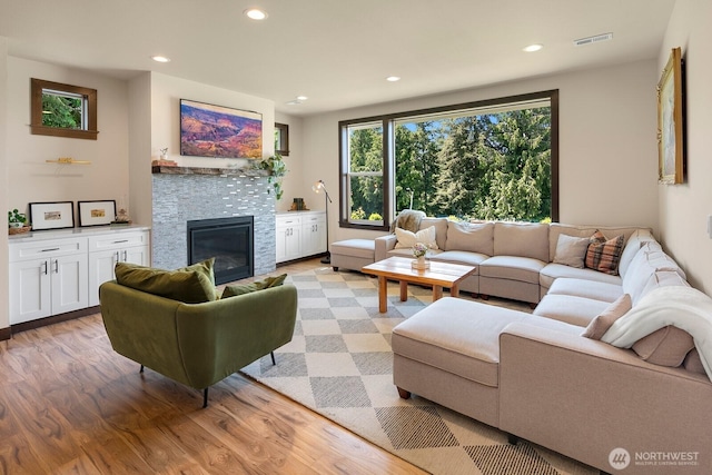1048 Malvern Hills Dr, Camano Island, WA 98282 - living area featuring light wood-style floors, a fireplace, and recessed lighting