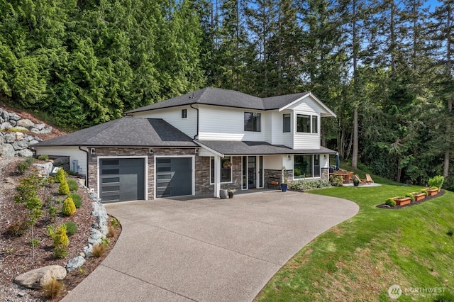 1048 Malvern Hills Dr, Camano Island, WA 98282 - view of front facade with a porch, an attached garage, driveway, a front lawn, and stone siding