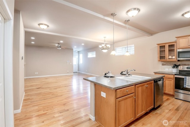 7628 Kodiak Ave NE, Lacey, WA 98516 - kitchen featuring stainless steel appliances, a ceiling fan, light wood-style floors, hanging light fixtures, and glass insert cabinets