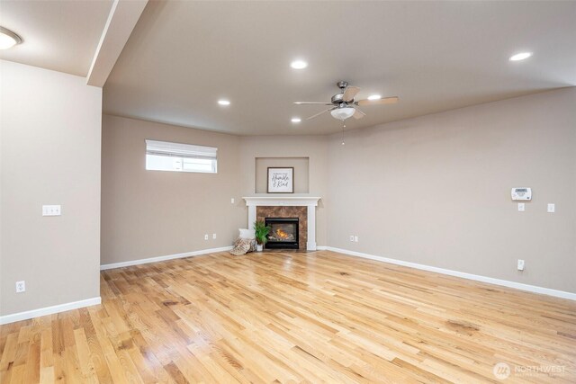 7628 Kodiak Ave NE, Lacey, WA 98516 - unfurnished living room with a ceiling fan, light wood-style floors, a fireplace, and recessed lighting