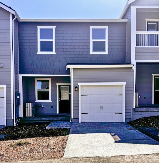 1205 E 53rd St, Tacoma, WA 98404 - townhome / multi-family property with a garage and driveway