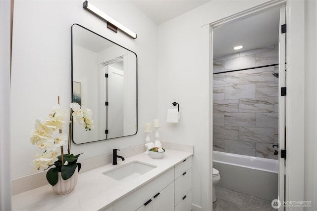 full bathroom featuring toilet, vanity, and bathing tub / shower combination
