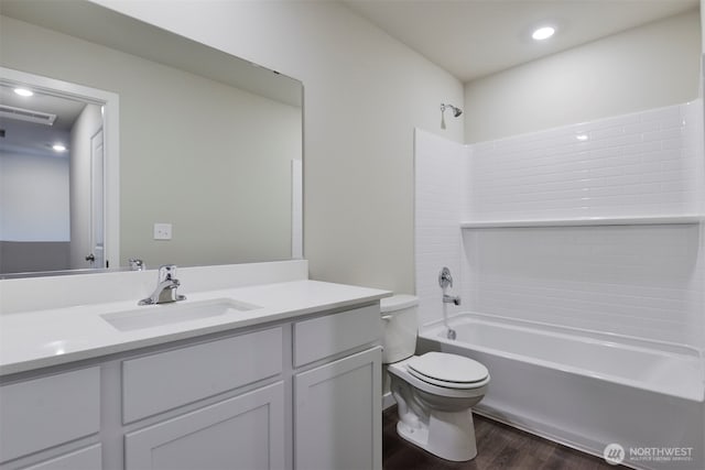 1308 E 53rd St, Tacoma, WA 98404 - bathroom with toilet, wood finished floors, vanity, shower / bathtub combination, and recessed lighting