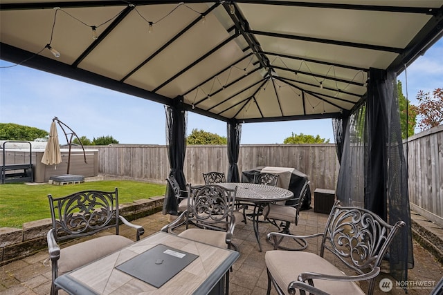 4019 N Vassault St, Tacoma, WA 98407 - fenced backyard featuring outdoor dining area, a patio, and a gazebo