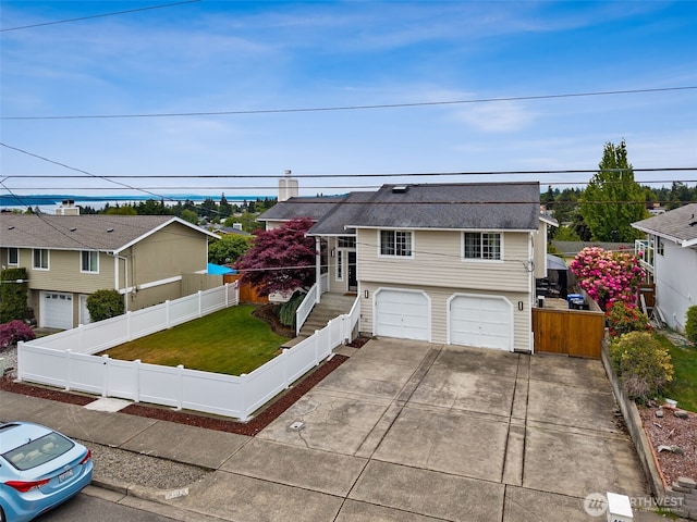 4019 N Vassault St, Tacoma, WA 98407 - view of front of house featuring driveway and a garage