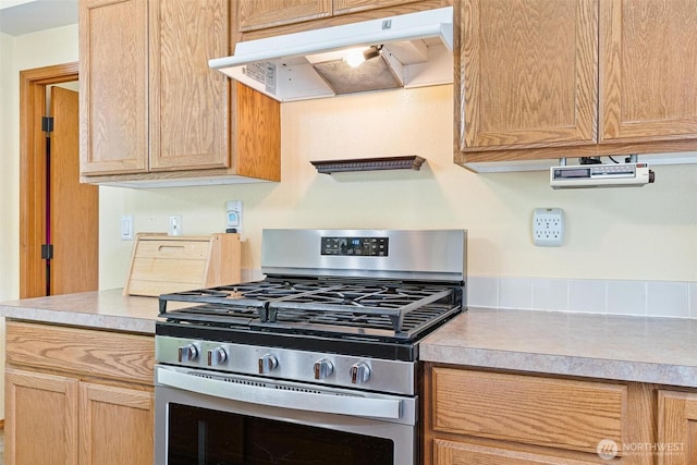 25420 354th Ave SE, Ravensdale, WA 98051 - kitchen featuring gas stove, under cabinet range hood, light countertops, and light brown cabinetry