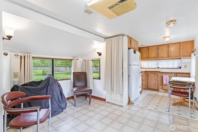25420 354th Ave SE, Ravensdale, WA 98051 - kitchen featuring freestanding refrigerator, light flooring, lofted ceiling, light countertops, and open floor plan