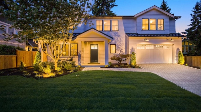 11440 109th Ave NE, Kirkland, WA 98033 - view of front facade with a standing seam roof, decorative driveway, a garage, and metal roof