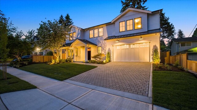 11440 109th Ave NE, Kirkland, WA 98033 - view of front of property with a standing seam roof, decorative driveway, an attached garage, and metal roof