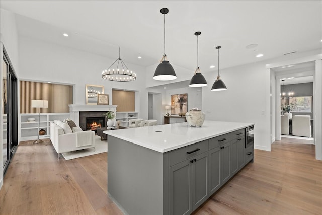 11440 109th Ave NE, Kirkland, WA 98033 - kitchen with gray cabinets, light wood-type flooring, a kitchen island, light countertops, and recessed lighting