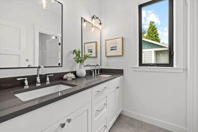 11440 109th Ave NE, Kirkland, WA 98033 - full bathroom with double vanity, baseboards, and tile patterned flooring