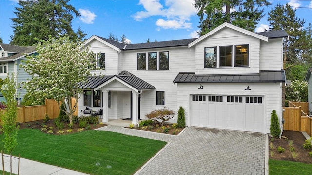 11440 109th Ave NE, Kirkland, WA 98033 - modern inspired farmhouse featuring a standing seam roof, an attached garage, metal roof, and decorative driveway