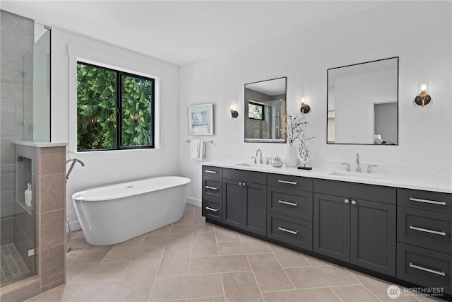 11440 109th Ave NE, Kirkland, WA 98033 - bathroom featuring double vanity, a shower stall, a soaking tub, and tile patterned flooring