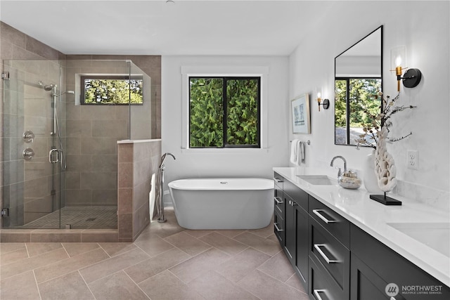 11440 109th Ave NE, Kirkland, WA 98033 - full bathroom featuring double vanity, a shower stall, a soaking tub, and tile patterned floors