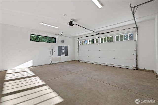 11440 109th Ave NE, Kirkland, WA 98033 - garage featuring electric panel and a garage door opener