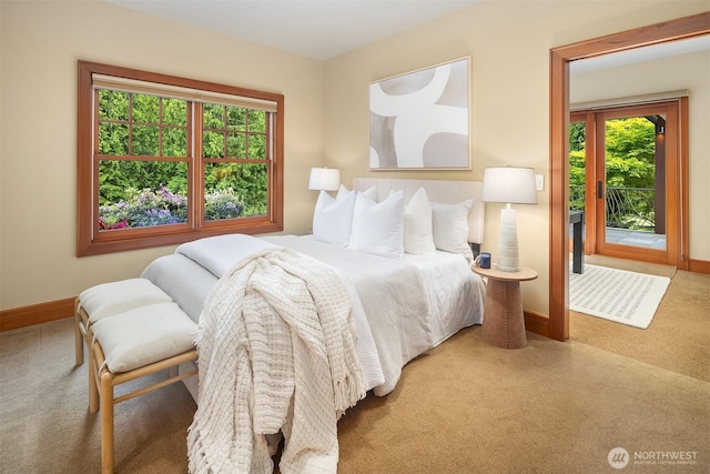 26970 SE Old Black Nugget Rd, Issaquah, WA 98029 - carpeted bedroom featuring access to outside, multiple windows, and baseboards