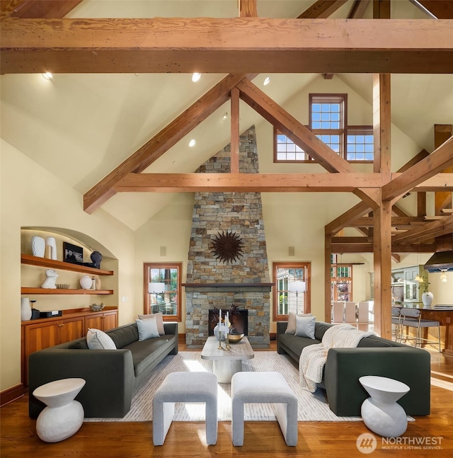 26970 SE Old Black Nugget Rd, Issaquah, WA 98029 - living room featuring high vaulted ceiling, beamed ceiling, wood finished floors, a fireplace, and recessed lighting