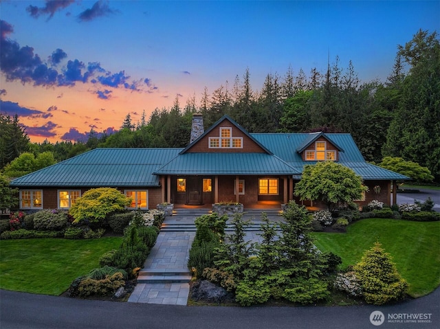 26970 SE Old Black Nugget Rd, Issaquah, WA 98029 - view of front of property featuring a standing seam roof, a yard, a chimney, and metal roof