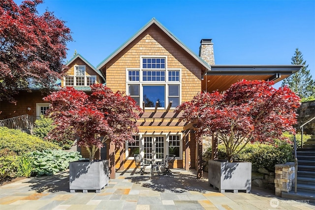 26970 SE Old Black Nugget Rd, Issaquah, WA 98029 - rear view of house featuring french doors, a patio, a chimney, and a pergola