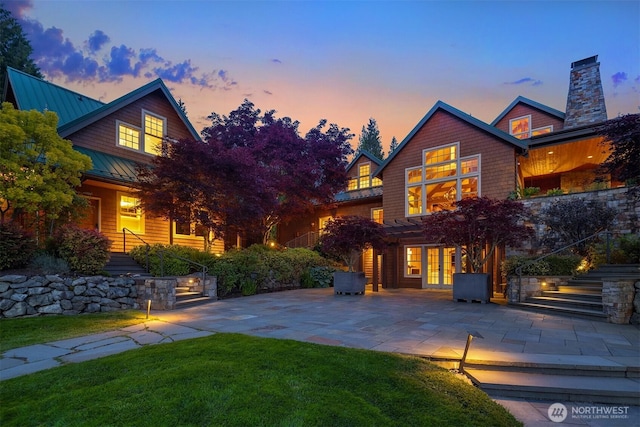 26970 SE Old Black Nugget Rd, Issaquah, WA 98029 - rear view of house with a standing seam roof, french doors, a yard, stairs, and a patio area