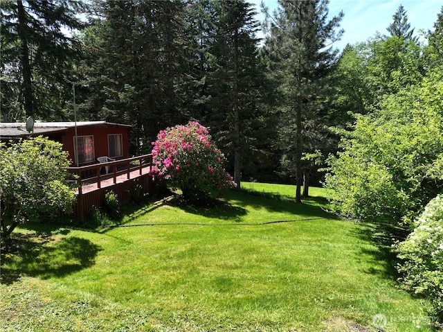 132 Claudine Ct, Kelso, WA 98626 - view of green lawn featuring a wooden deck and a view of trees
