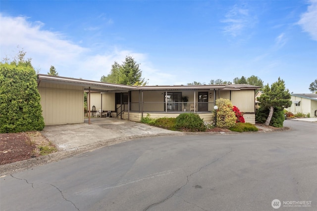 11436SE 208th St Unit 180, Kent, WA 98031 - view of front facade featuring an attached carport and concrete driveway