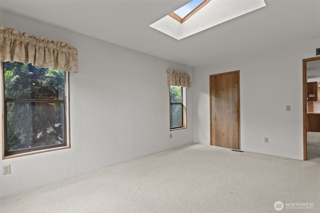11436SE 208th St Unit 180, Kent, WA 98031 - carpeted empty room featuring a skylight