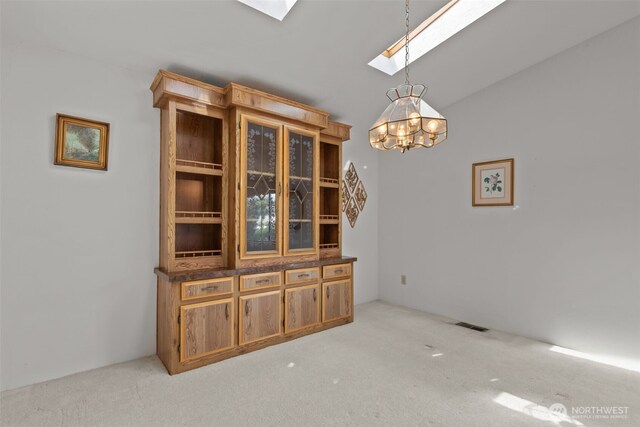 11436SE 208th St Unit 180, Kent, WA 98031 - unfurnished dining area featuring a skylight, carpet, a chandelier, and vaulted ceiling
