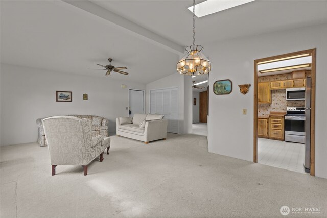 11436SE 208th St Unit 180, Kent, WA 98031 - living room with a ceiling fan, light carpet, a skylight, and a chandelier